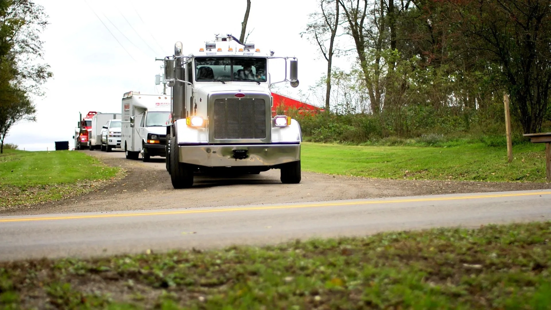 Trucks headin out to a job. Northwest Pennsylvania's most trusted septic and drain cleaning service.